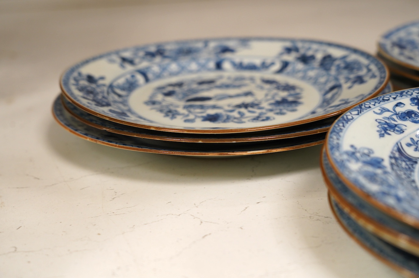 Ten 18th century Chinese export blue and white porcelain plates, each 23cm diameter. Condition - fair, some minor chipping